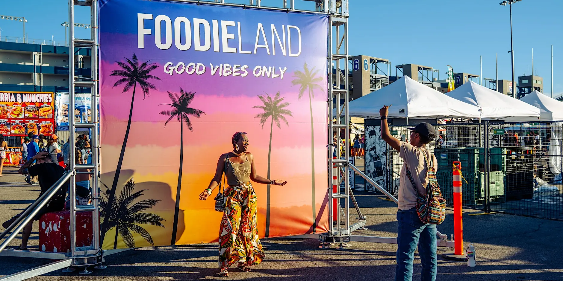 FoodieLand Food Festival vendor booths with crowd